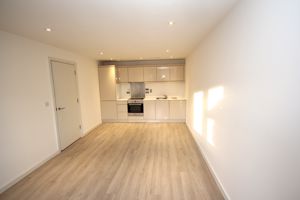 Open plan sitting room kitchen- click for photo gallery